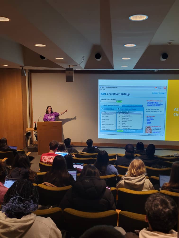 Sara lecturing in front of students, 2025